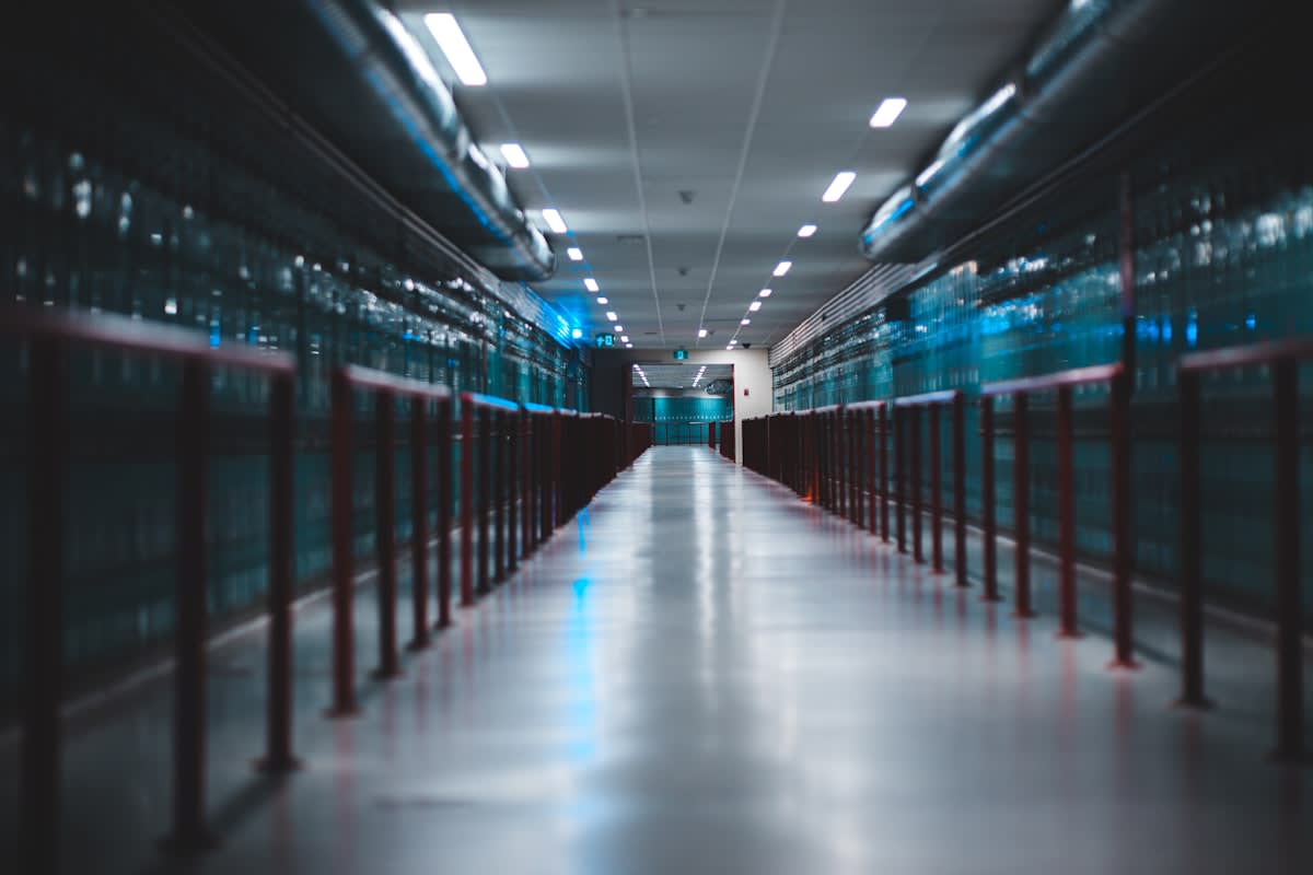 Modern high-tech data center with glowing blue server racks
