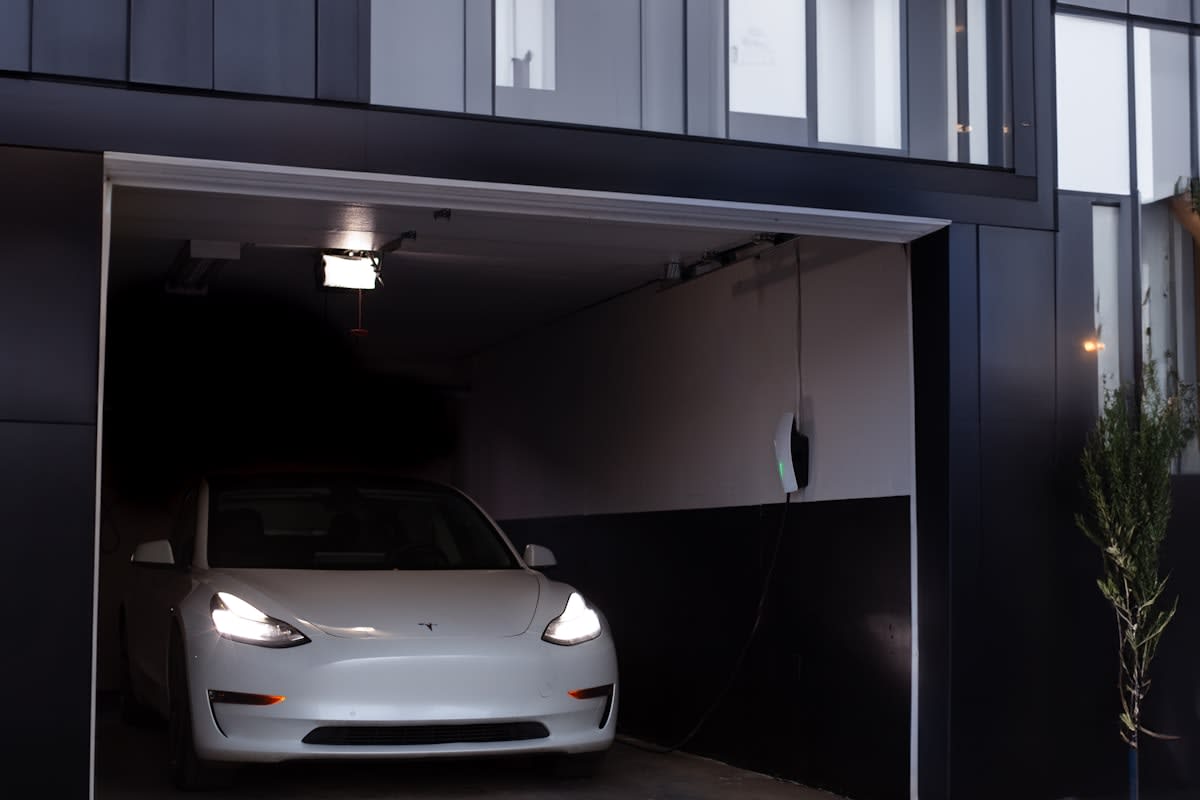 Electric vehicle charging station in a modern garage