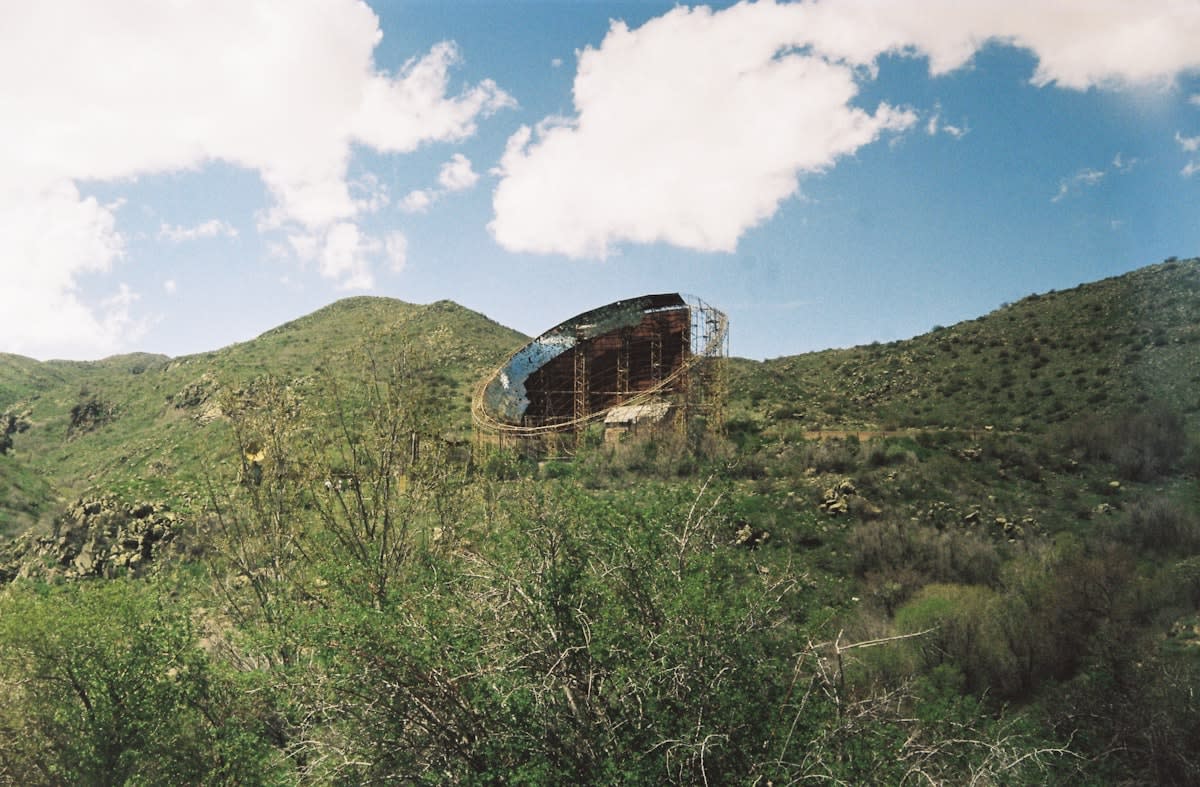 futuristic sustainable architecture in a remote landscape