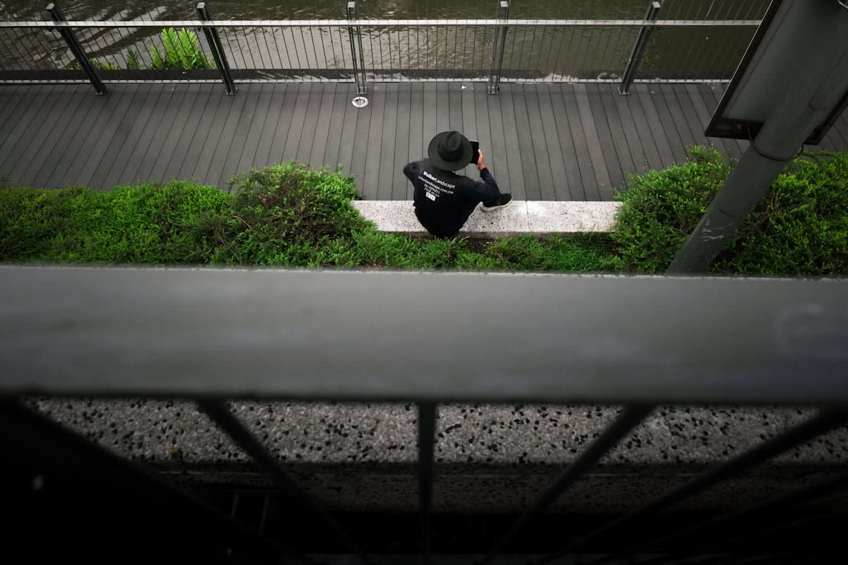 Close up of a person meditating in a high-tech urban environment