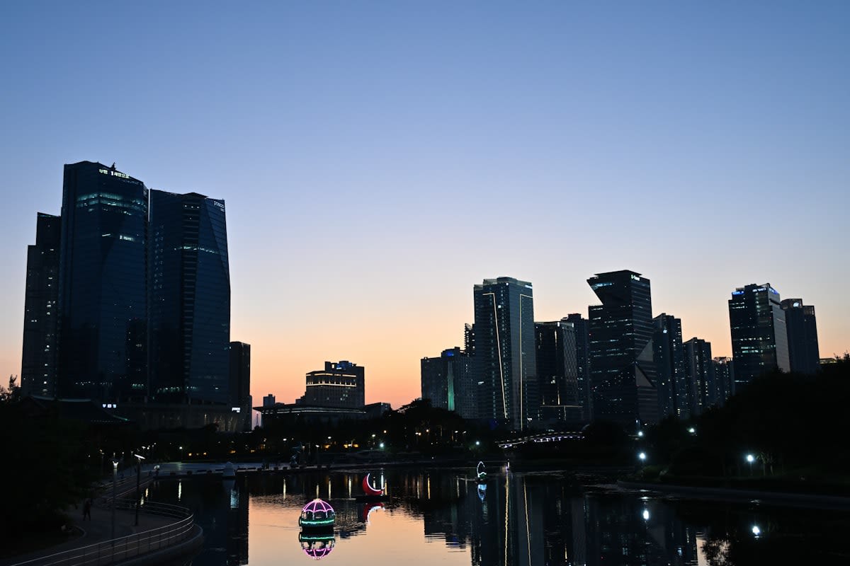 Modern skyscraper reflecting city lights