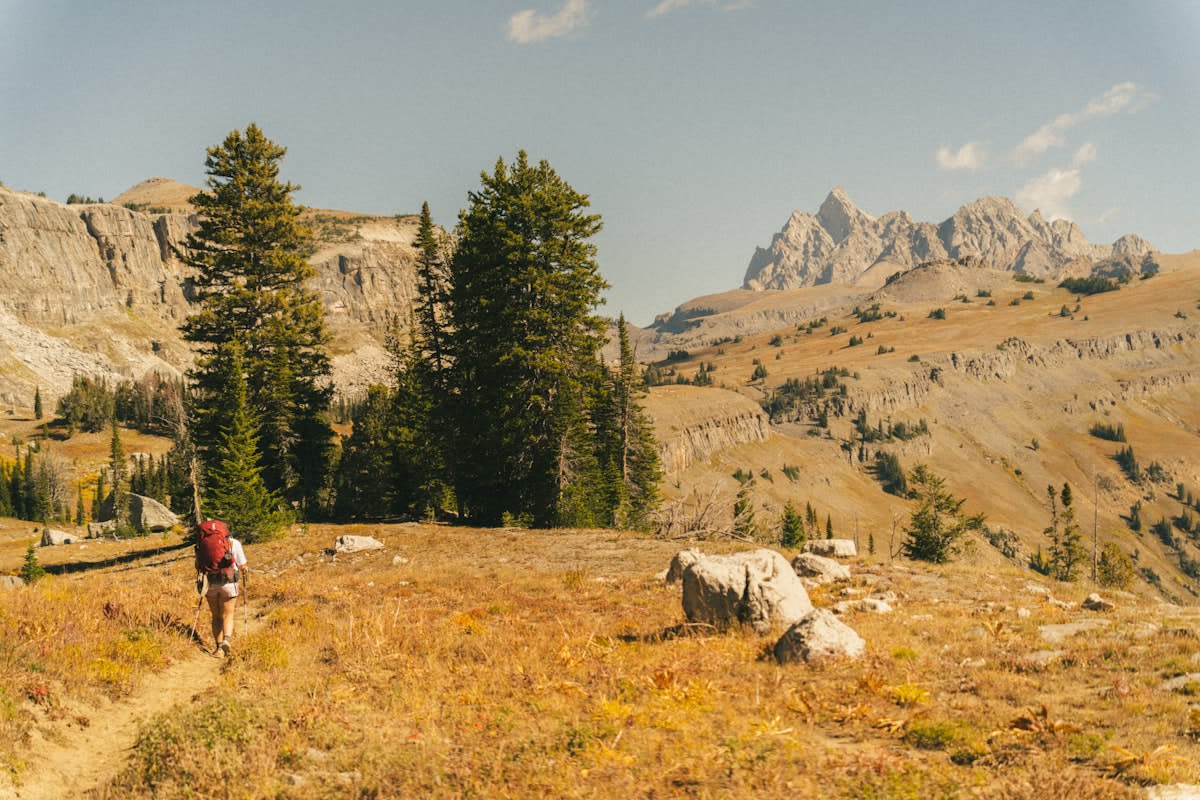 Ultra marathon runner in rugged mountain terrain