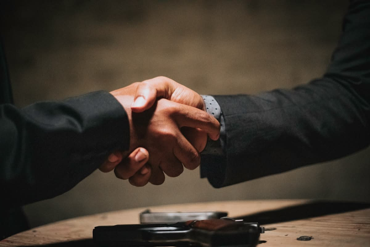 A close up of a handshake
