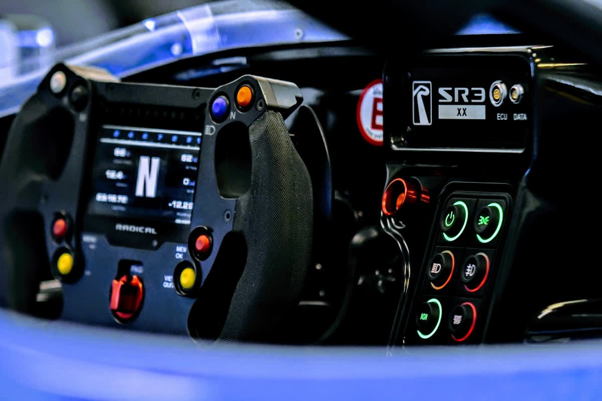 F1 driver in a cockpit with data overlays