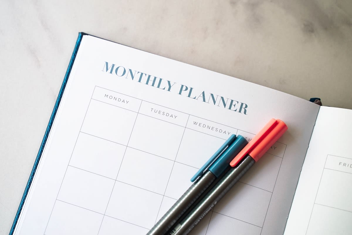 Close up of a planner and a pen