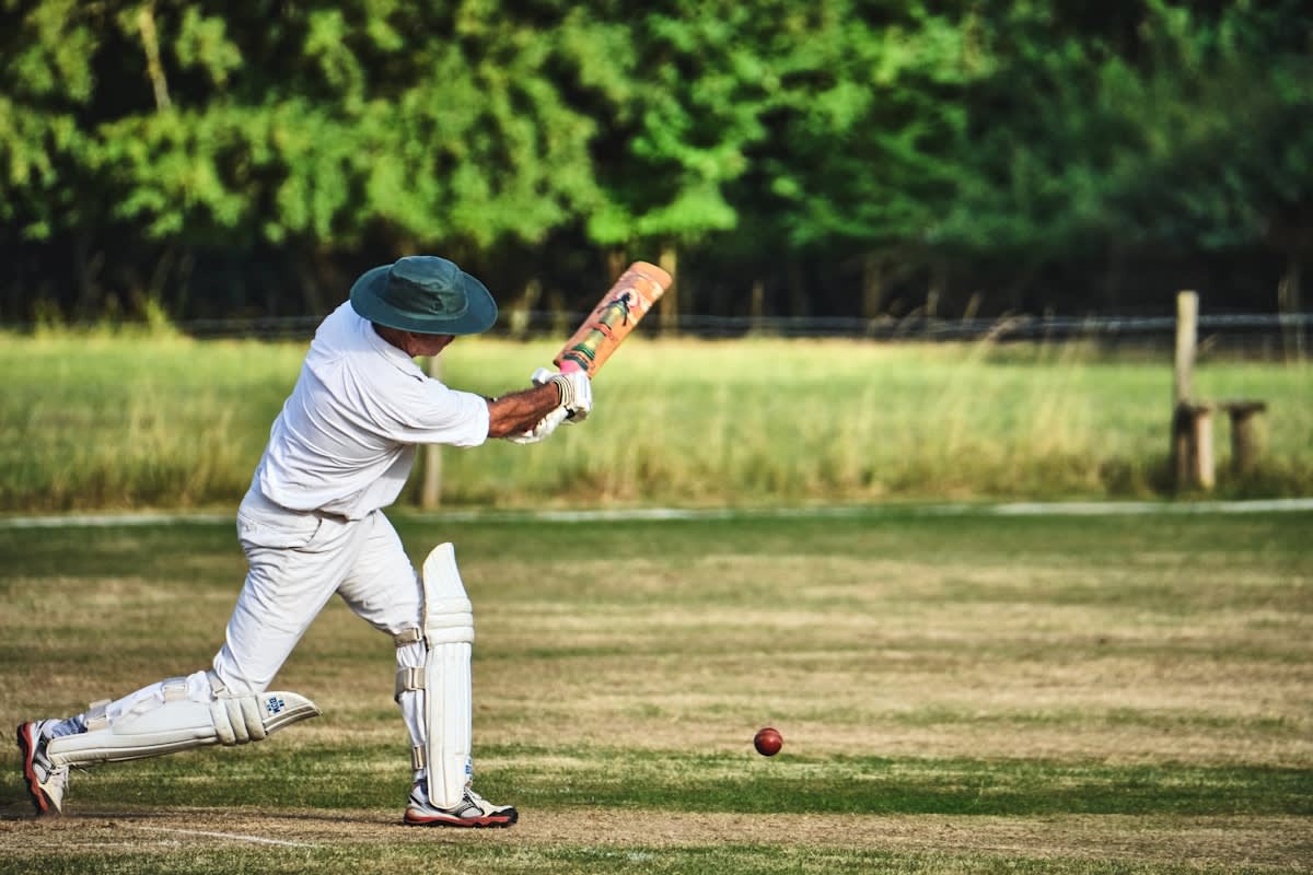 Cricket player focusing on the ball