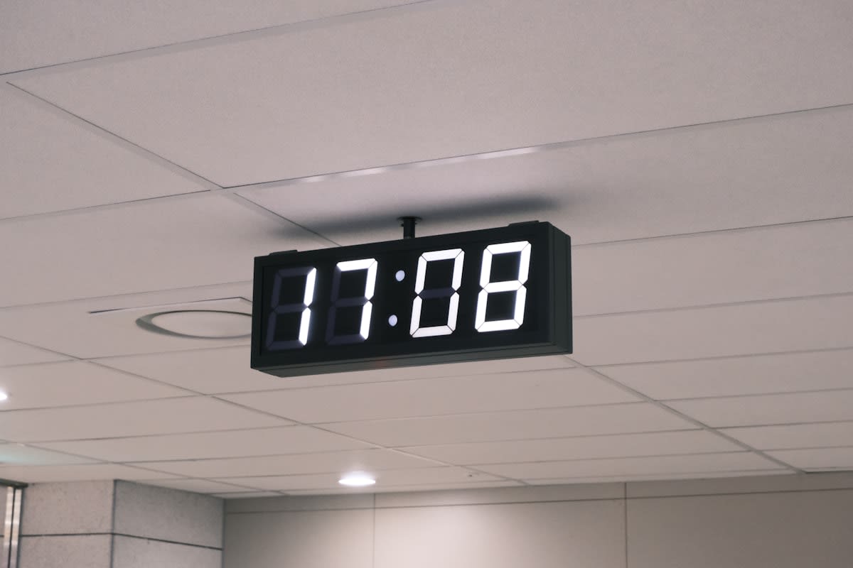a digital clock showing a scheduled time block