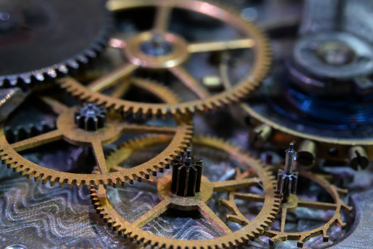 Vintage railway clock and steampunk gears