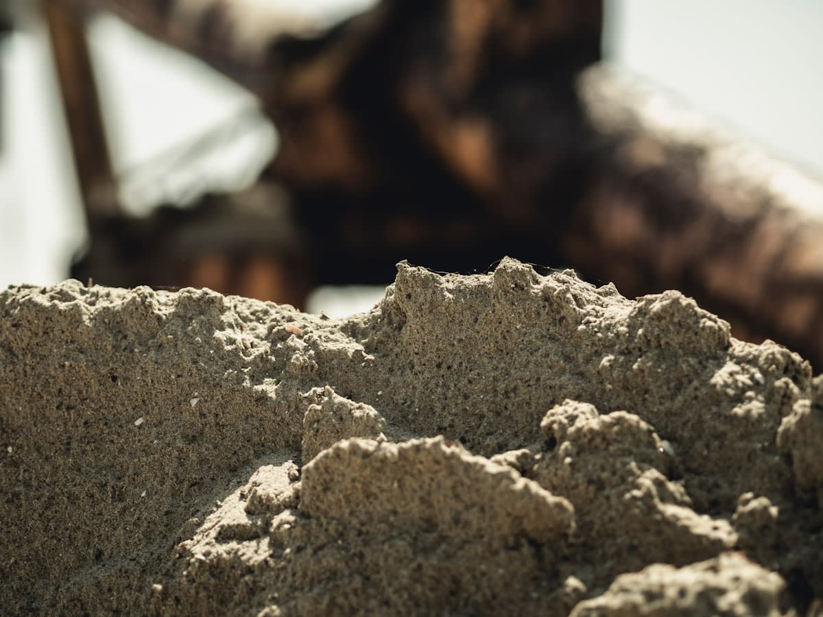 Close up of industrial sand and pipes