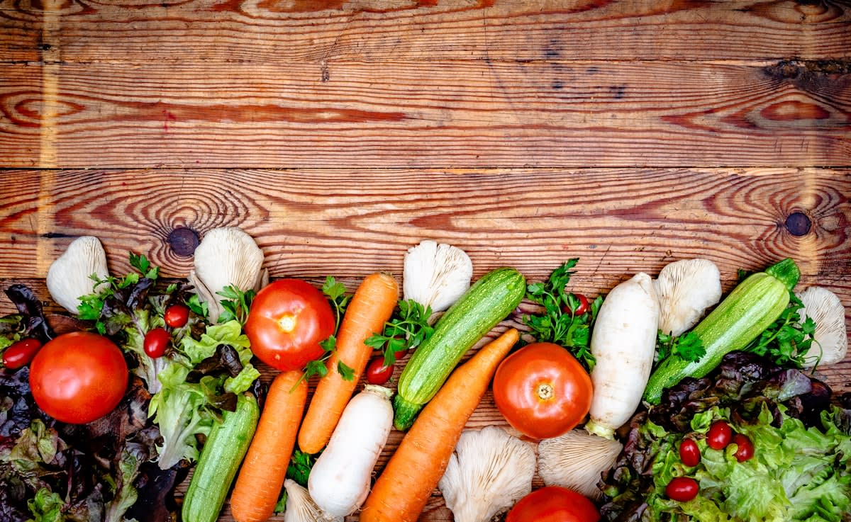 Fresh colorful vegetables and legumes on a rustic table