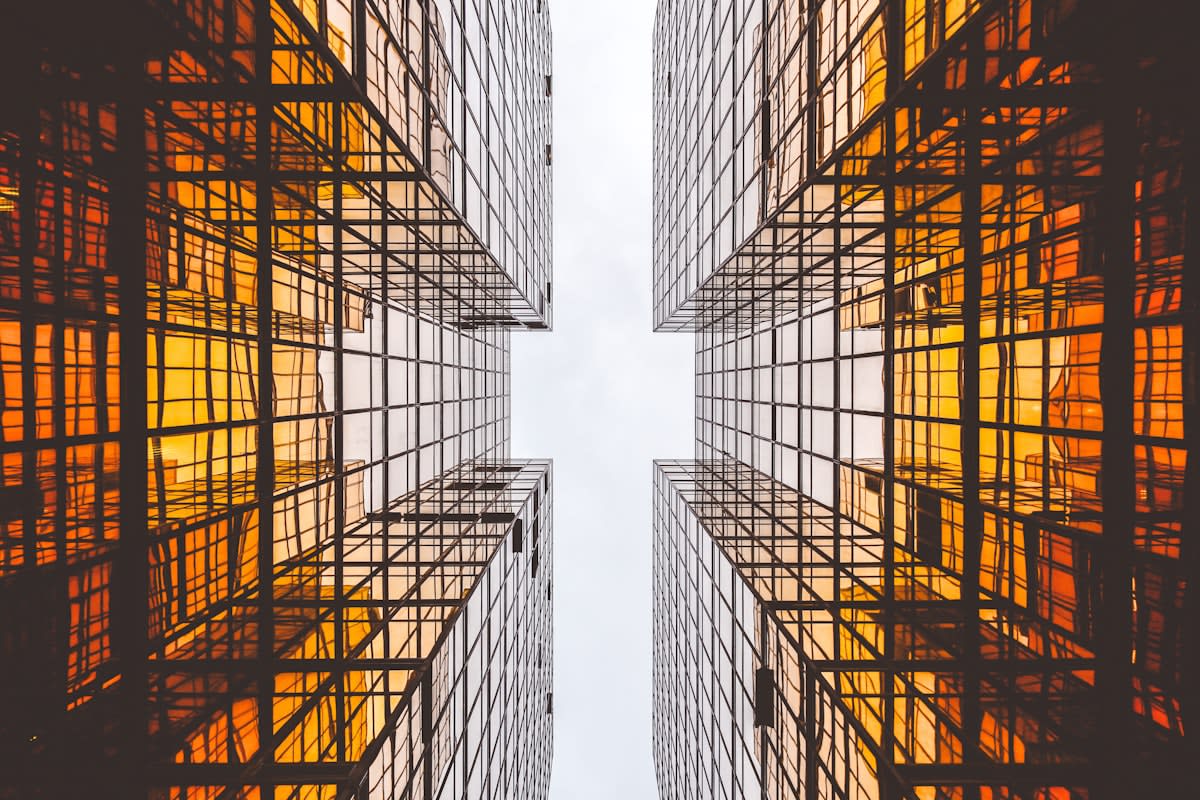 Modern skyscraper architecture reflecting digital grids