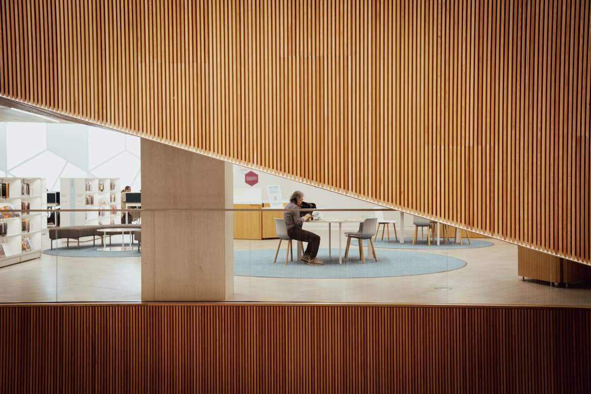 Person working in a minimalist environment with an analog timer