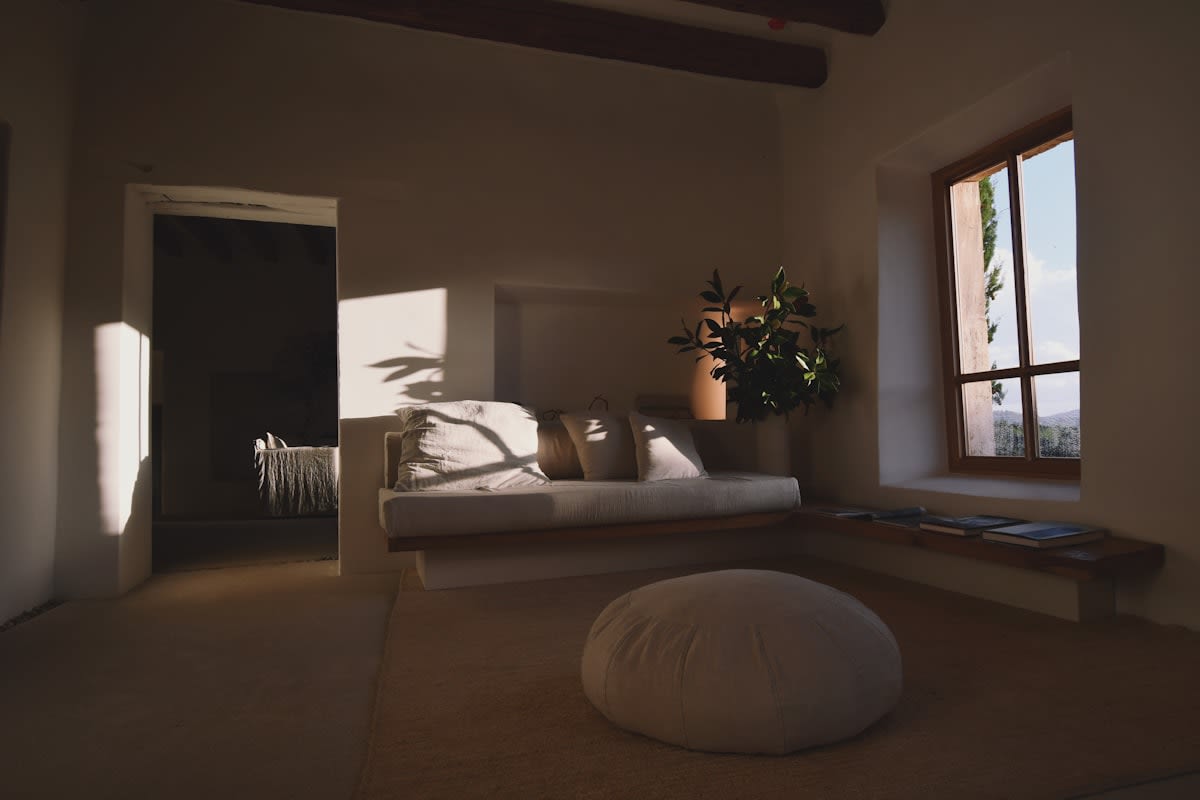 A serene interior with muted tones, soft textures, and natural light