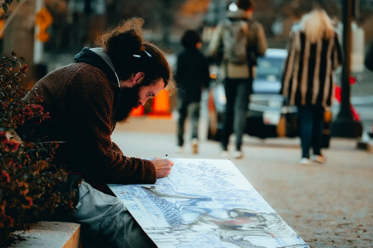 A person looking at a paper map in a city