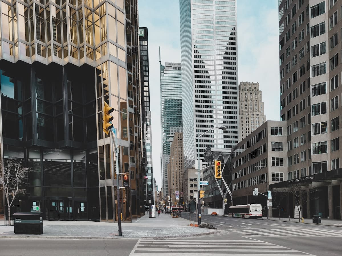 Empty modern city street with skyscrapers