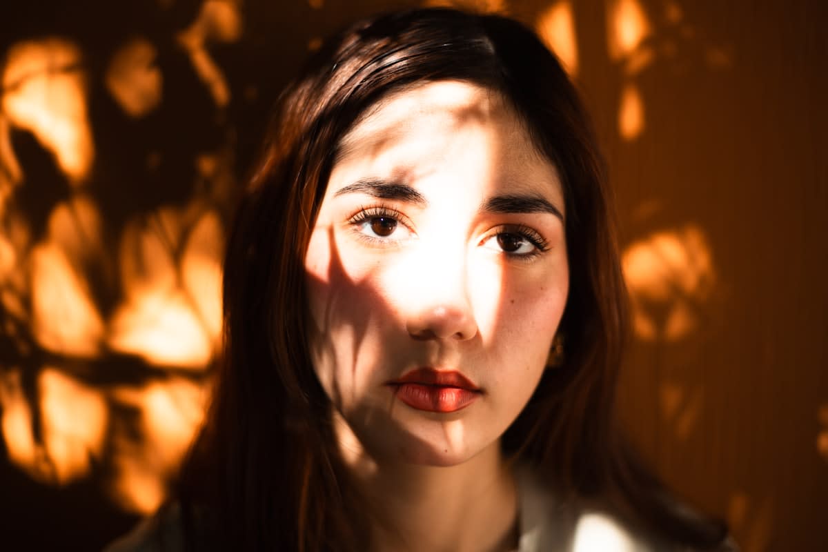 Morning sunlight hitting a person's face in a bright room
