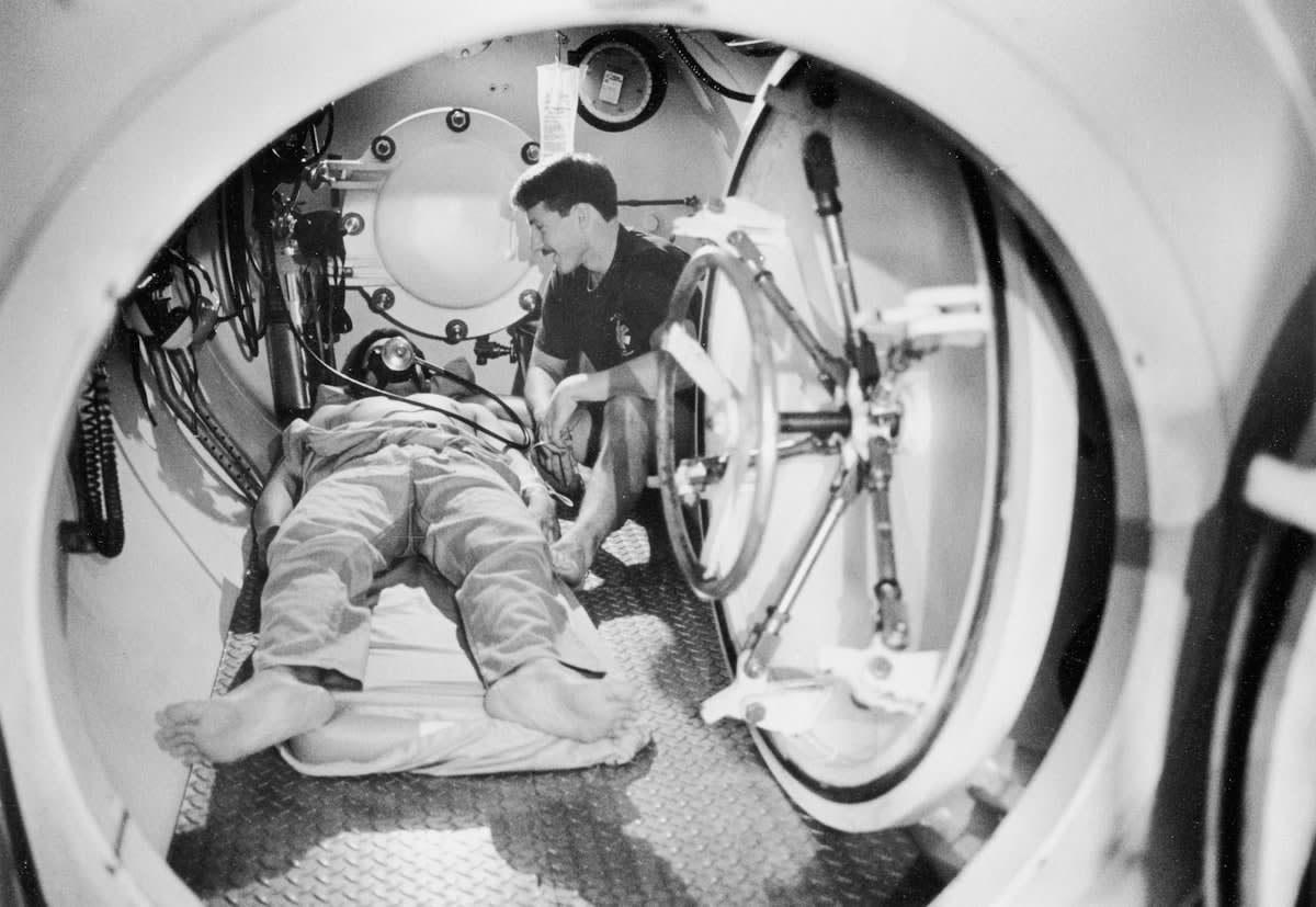 Athlete in a high tech recovery chamber