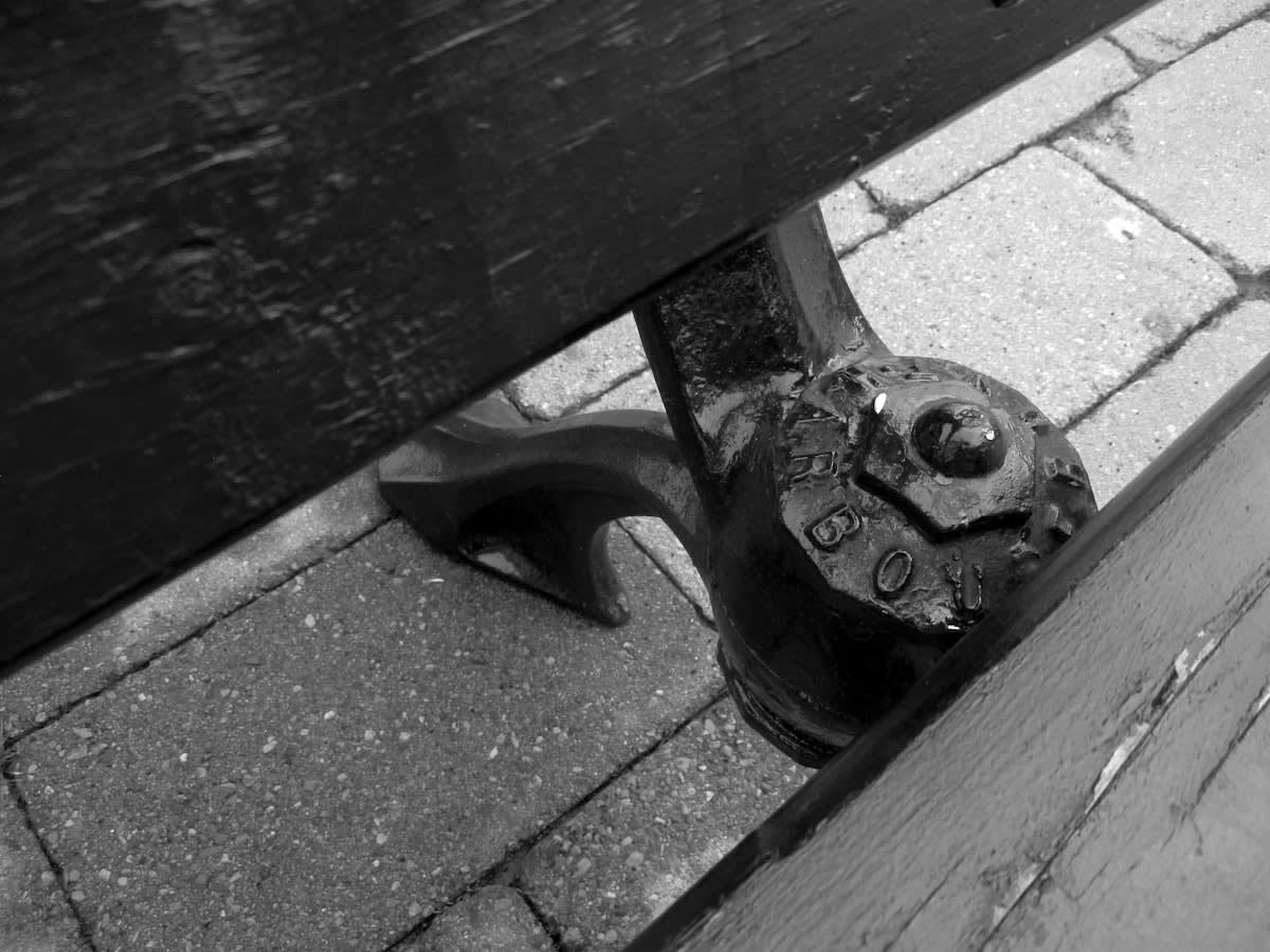 Detail of urban furniture with anti-homeless spikes