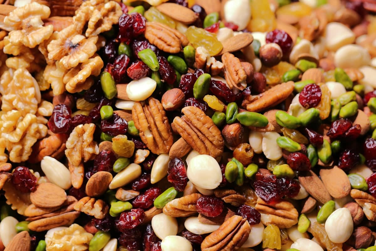 Close up of natural whole foods like nuts and avocado