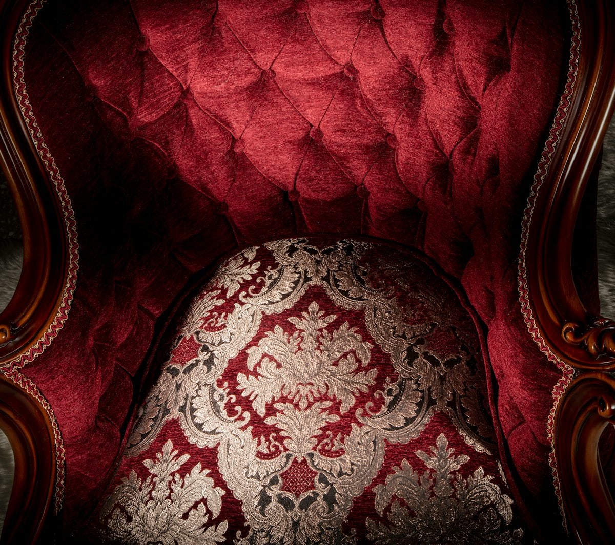 Luxury interior with rich textures, velvet fabrics, and ornate stone