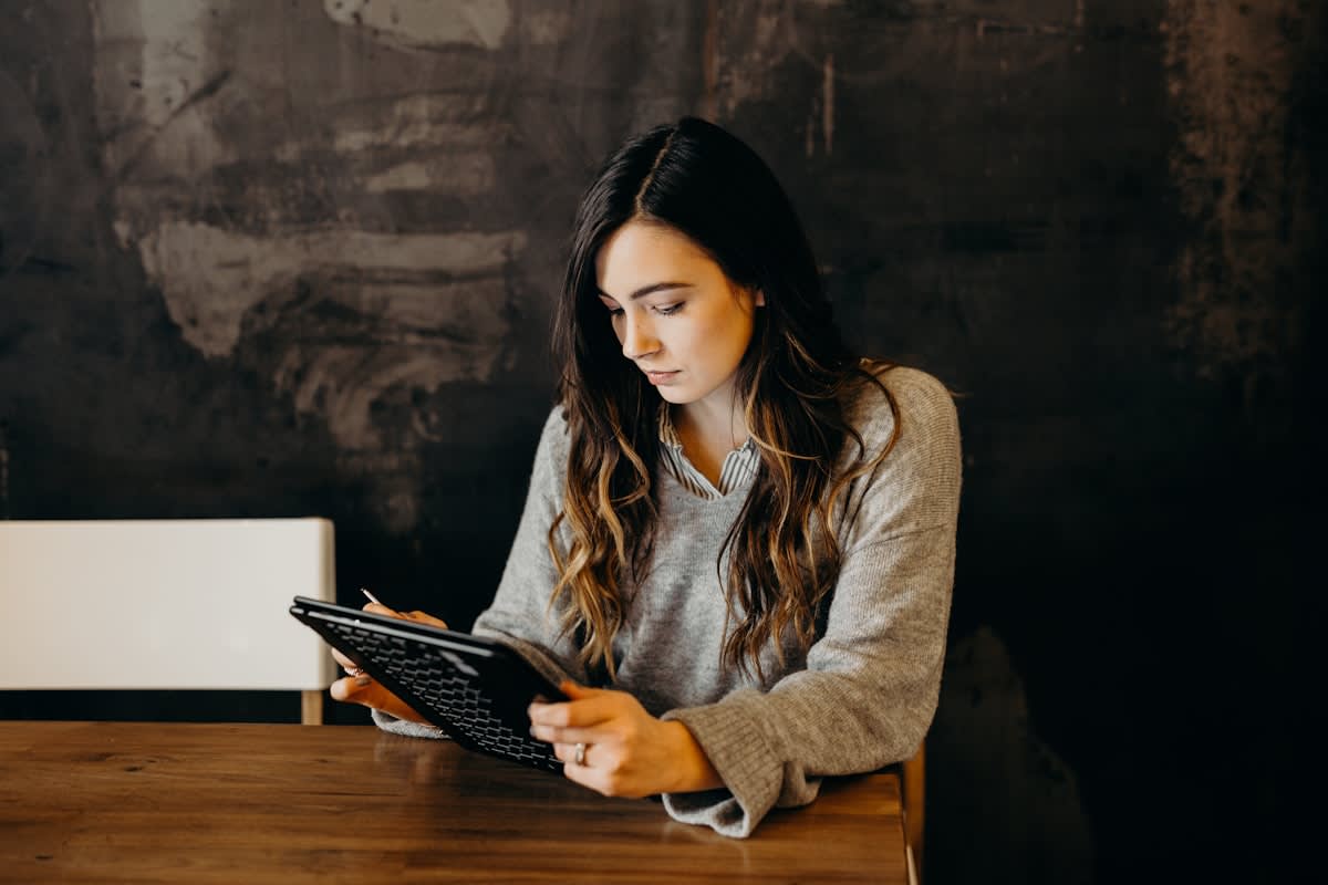 Person using a tablet with complex interactive diagrams