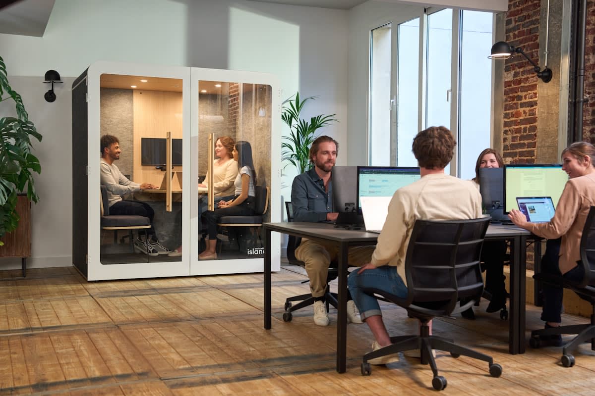 A diverse team collaborating remotely via digital screens
