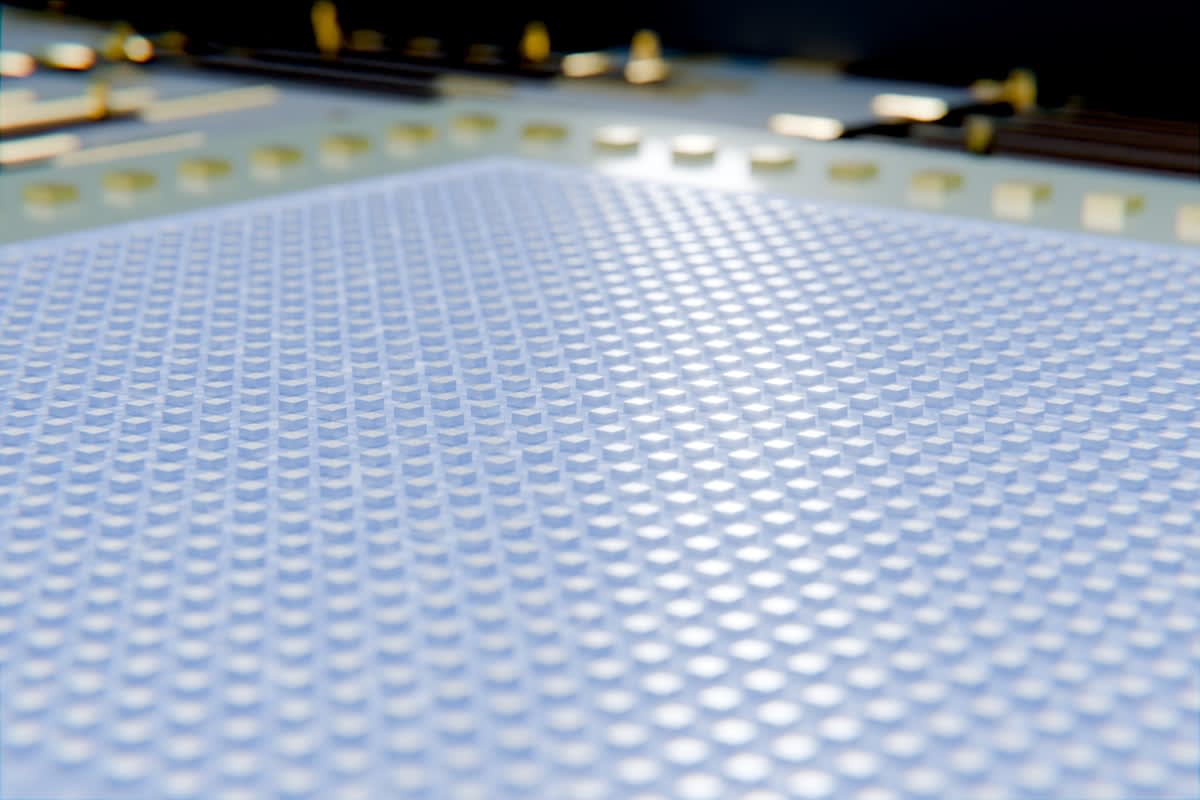 Close up of a high tech silicon wafer with glowing light paths
