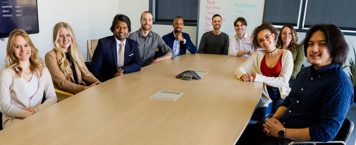 diverse group of professionals in a boardroom having a heated but professional debate