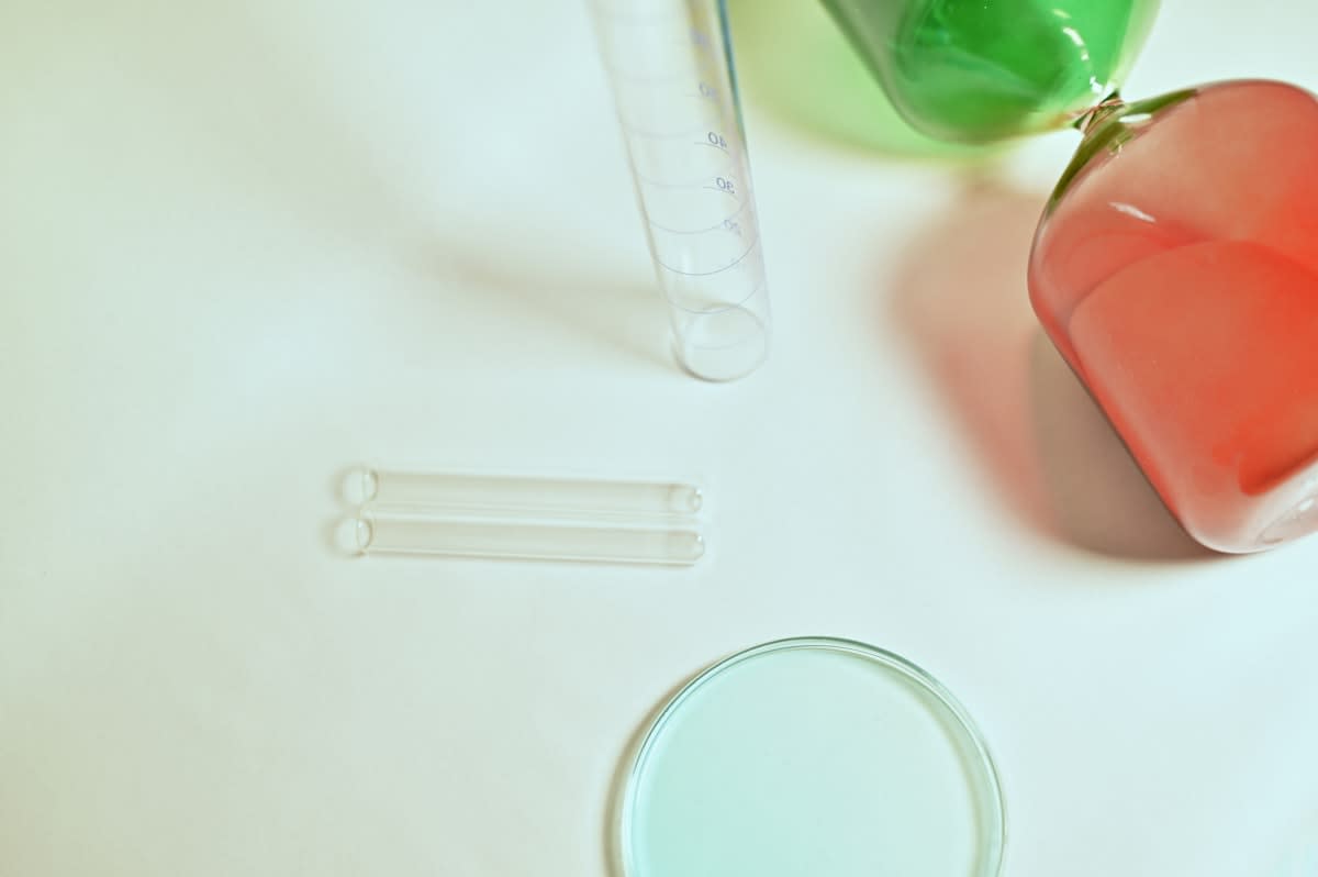 Close up of a laboratory petri dish and test tubes