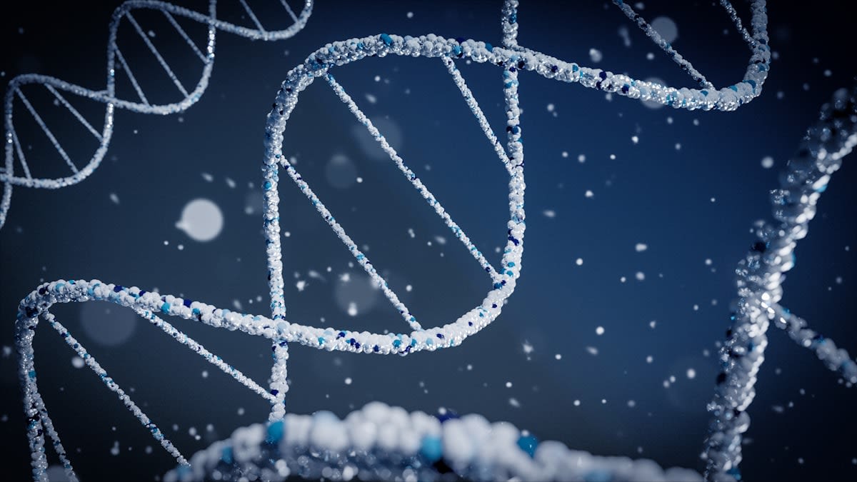 Close up of a blood sample vial and a DNA helix graphic