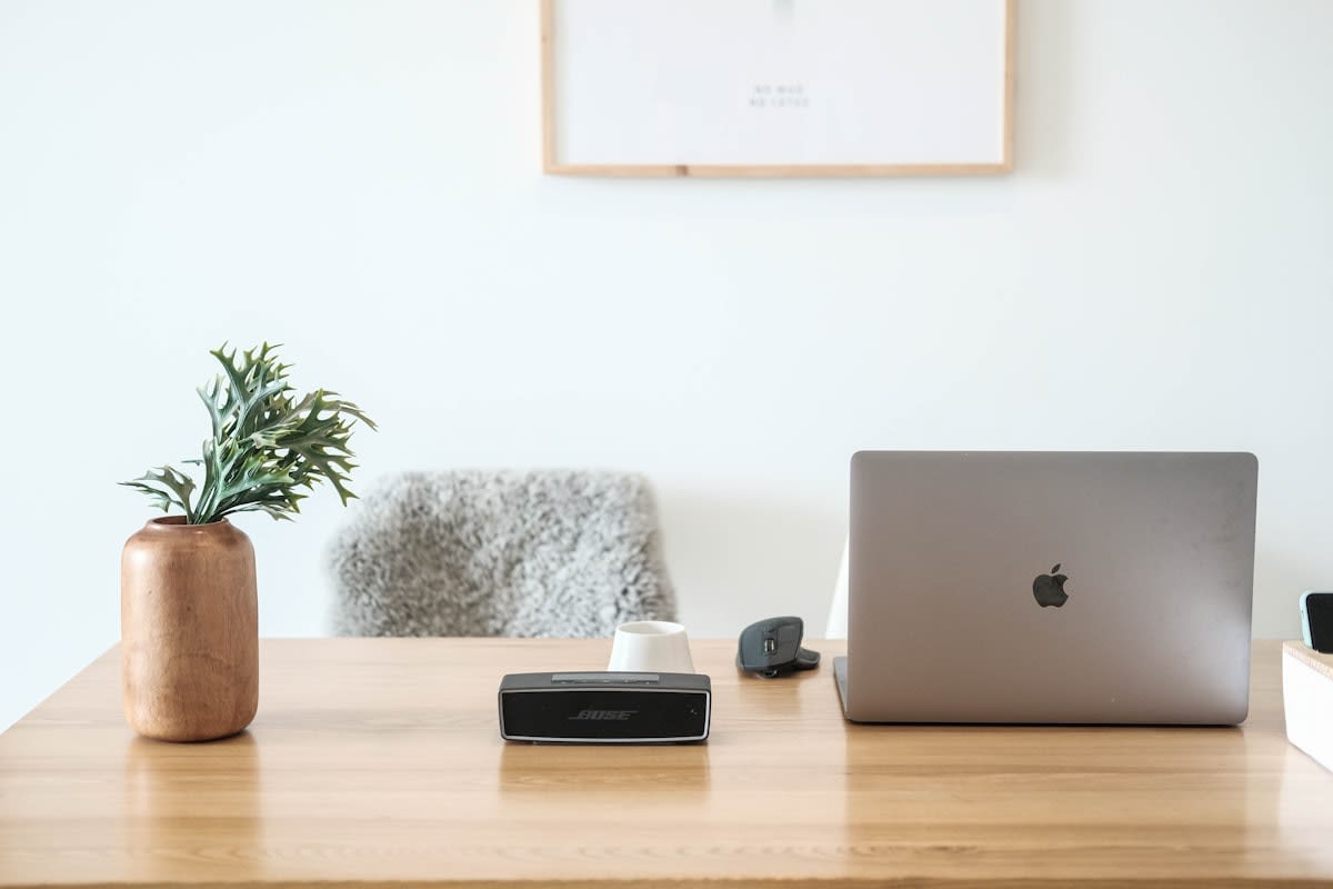 minimalist workspace with a notebook and a closed laptop