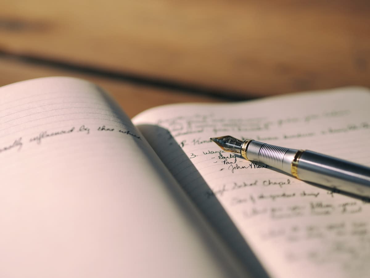 Close up of a pen and notebook with a strategic plan