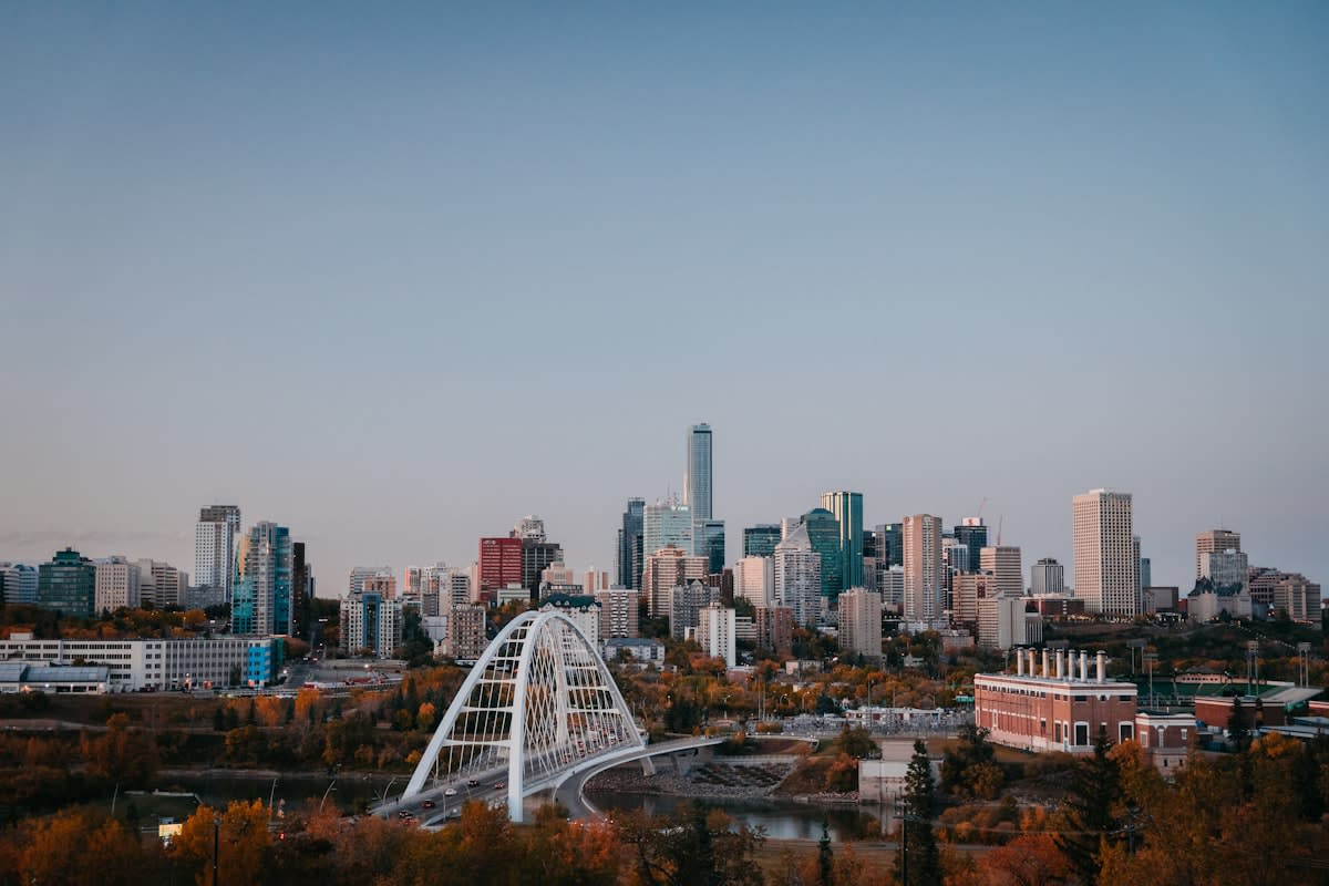 Modern city skyline with green spaces