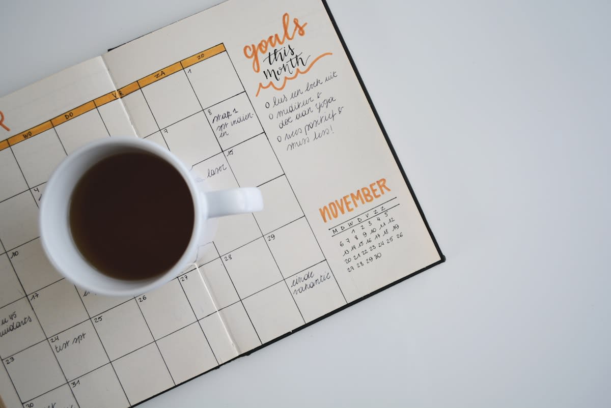 Close up of a physical planner with hand-written goals