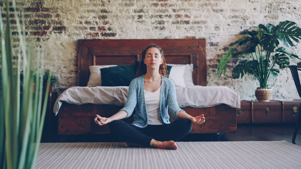 person practicing mindful breathing in a serene environment