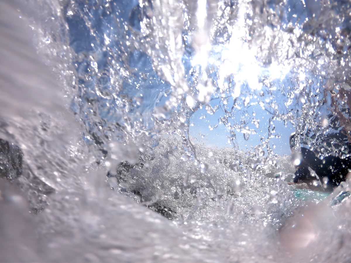 close up of water splashing on a face