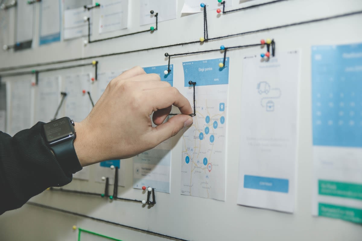 Strategic planning on a whiteboard with complex diagrams