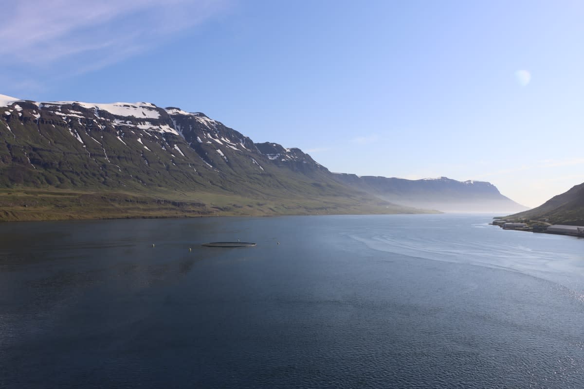 Misty mountains and a quiet lake in a northern region