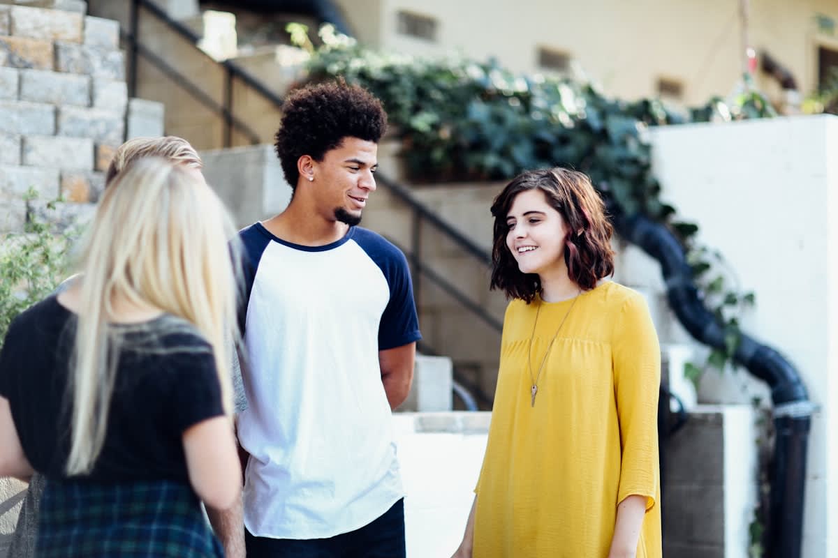 Group of young people talking in a circle