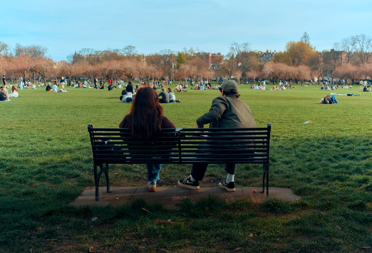 Two people in deep conversation in a public park