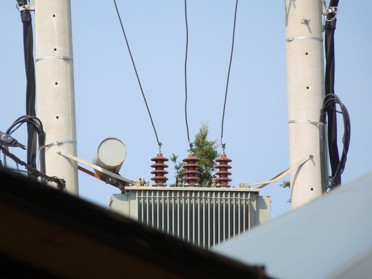 Close up of high voltage power lines and transformers