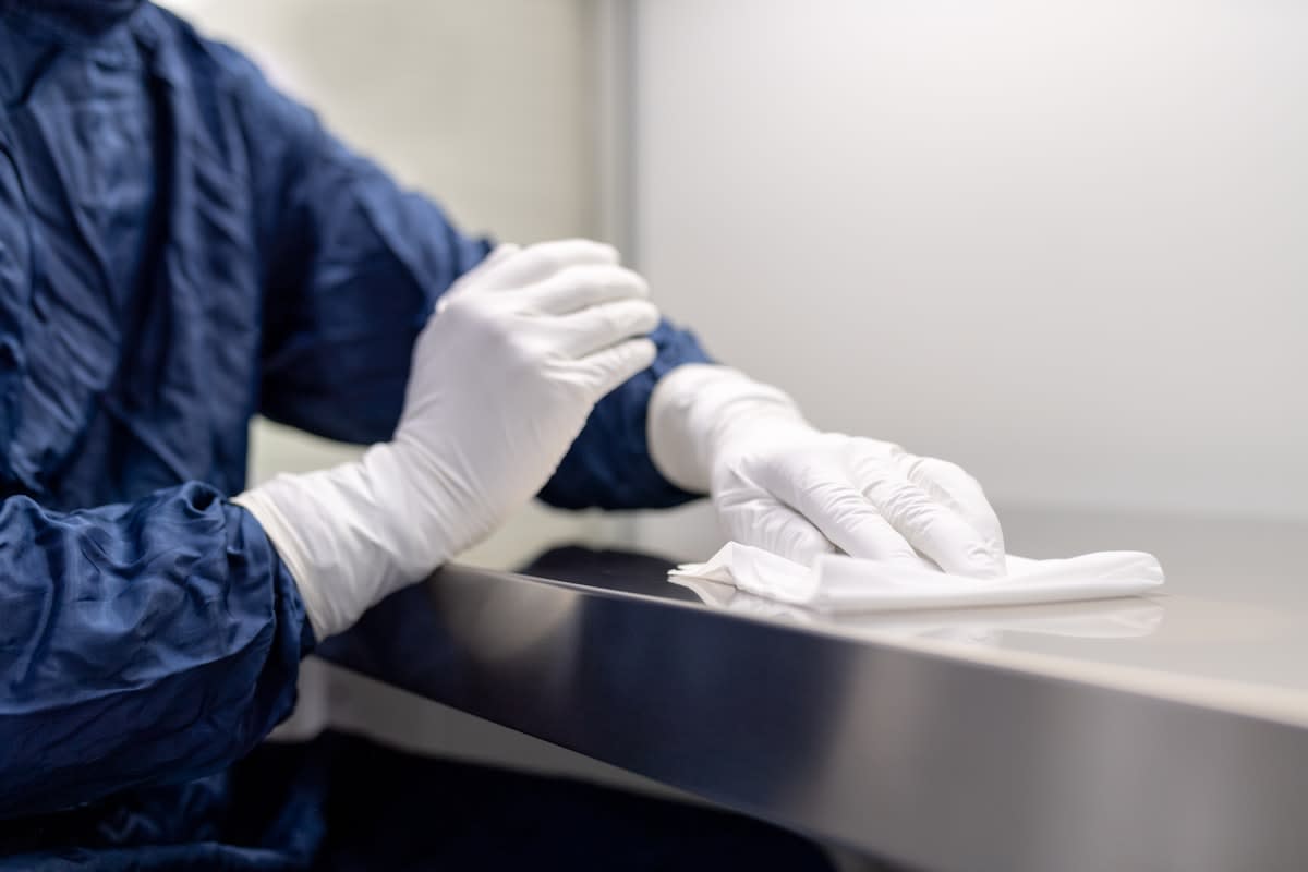 Scientist working in a clean room environment