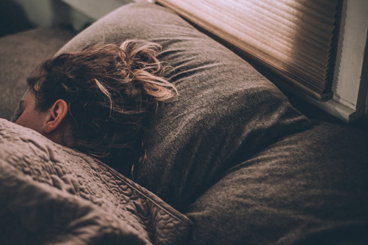 person waking up with sunlight hitting their face