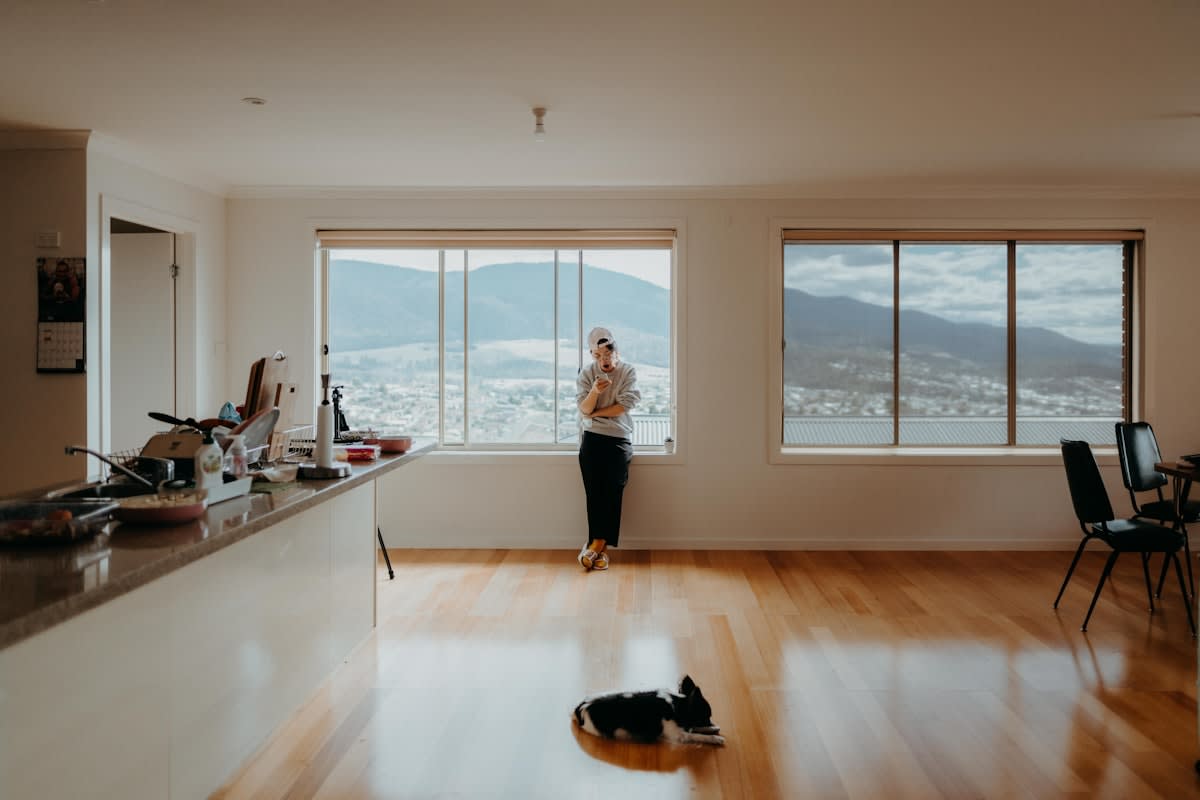 person stretching in a bright room