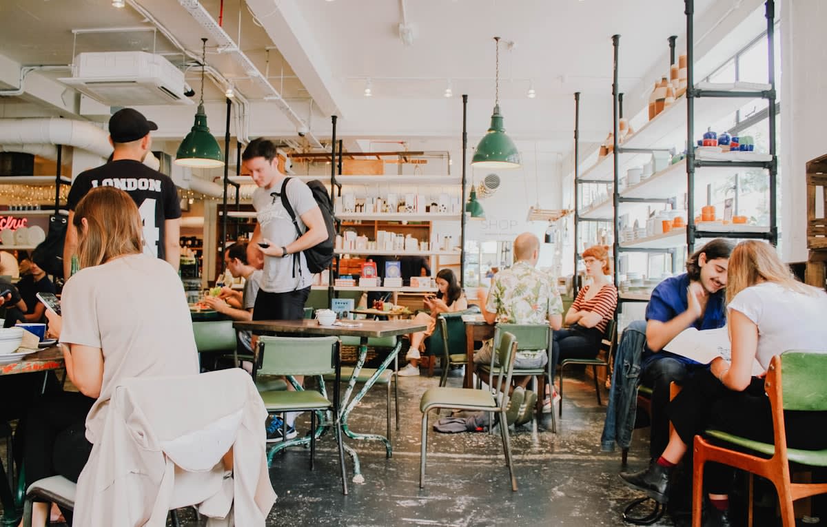 A bustling traditional cafe with people talking