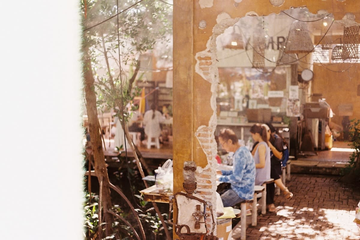 Modern urban cafe with people on laptops