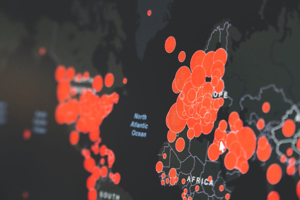Digital interface showing financial data and global maps