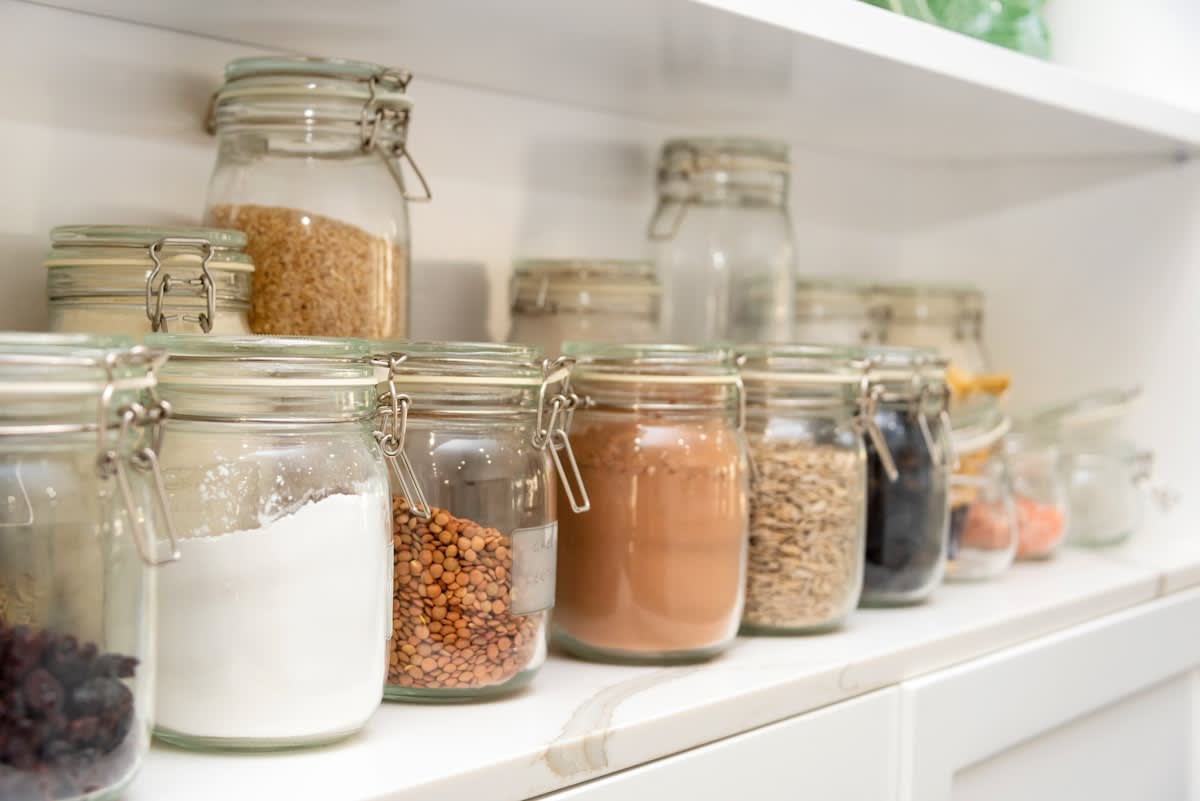 organized pantry with glass jars