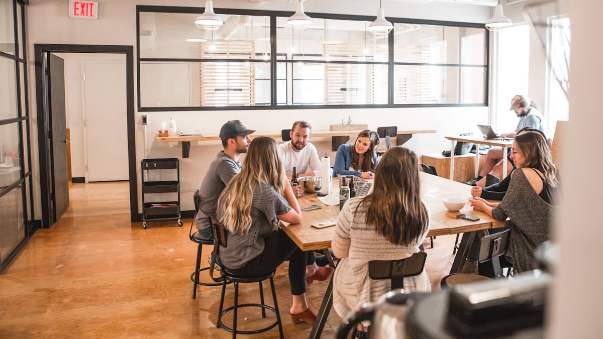 Diverse group of young professionals collaborating in a modern, open space