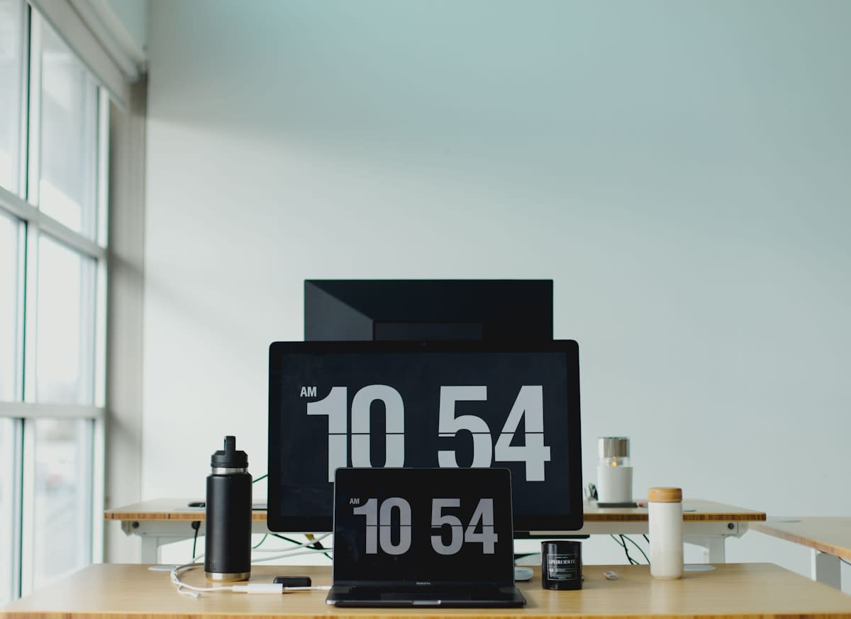 Modern office clock and digital screens